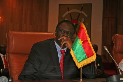 BURKINA FASO, Ouagadougou : Burkina Faso's interim president Michel Kafando delivers a speech as part of post-coup talks in Burkina Faso on September 23, 2015 in Ouagadougou. Burkina Faso's interim leader Michel Kafando was officially restored to power at a ceremony attended by regional heads of state on Wednesday, a week after a coup by an elite army unit. 