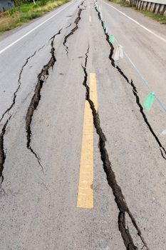 Asphalt road cracked and broken from earthquake.