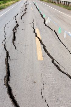 Asphalt road cracked and broken from earthquake.