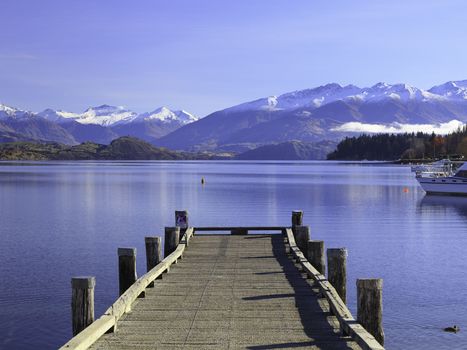 Beautiful View of Lake Wanaka and its jetty in autumn, Otago region, South Island, New Zealand.