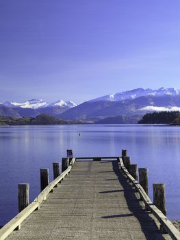 Beautiful View of Lake Wanaka and its jetty in autumn, Otago region, South Island, New Zealand.