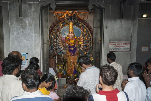 SINGAPORE,- MARCH 10, 2007 : People enjoying inside Kaliamman Temple in Singapore on March 10 2007, this temple is the biggest hindu temple in Singapore