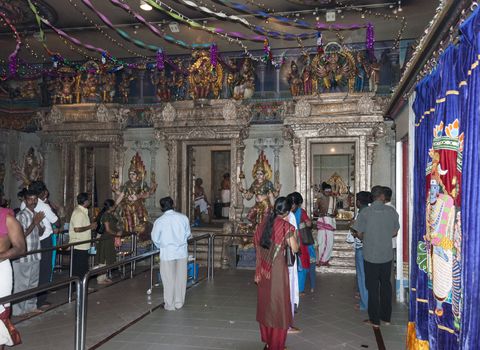 SINGAPORE,- MARCH 10, 2007 : People enjoying inside Kaliamman Temple in Singapore on March 10 2007, this temple is the biggest hindu temple in Singapore