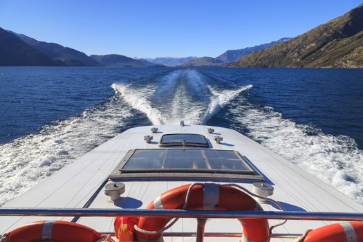Wake (propeller wash) from a cruise ship in Lake Wakatipu, Queenstown, Otago region, South Island, New Zealand.