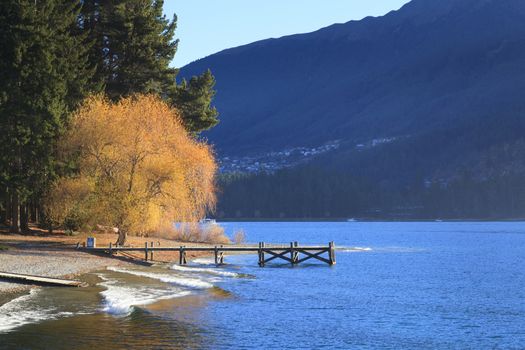 Beautiful scenic of Lake Wakatipu with small jetty, Queenstown, Otago region, South Island, New Zealand.
