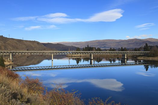 Road bridge over Lake Dunstan, Cromwell town, near Queenstown, Central Otago region, South Island, New Zealand.