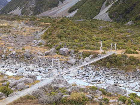 Bridge over Hooker River in Aoraki/Mount Cook national park, Canterbury, New Zealand.