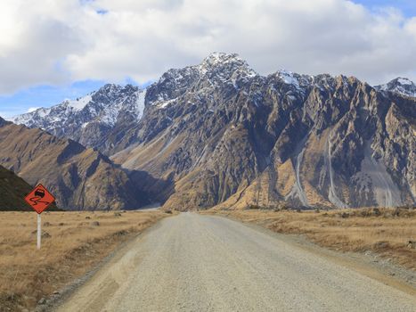 Gravel road leading to Tasman Valley in Aoraki Mount Cook National Park, Canterbury region, South Island, New Zealand.