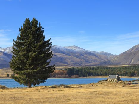 Beautiful landscape of Lake Tekapo with the Church of the Good Shepherd in far distance, South Island, New Zealand.