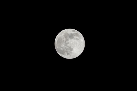 Full Moon isolated as Supermoon night with the closest approach the Moon makes to the Earth on its elliptical orbit, resulting in the largest apparent size of the lunar disk as seen from Earth.