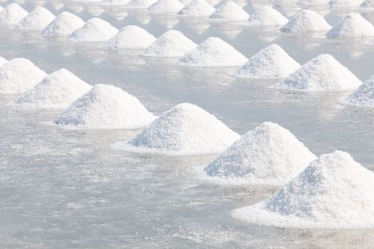 Heap of sea salt in salt farm ready for harvest,  Thailand.