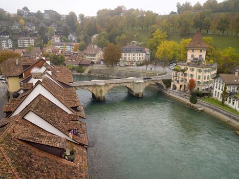 View of Bern or Berne, the capital city of Switzerland in the autumn morning mist. In 1983 the historic old town in the centre of Bern became a UNESCO World Heritage Site.