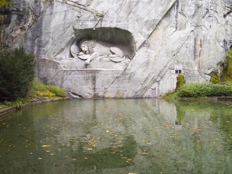 The Dying Lion Monument or the Lion of Lucerne. A historic landmark sculpture in Lucerne, Switzerland that commemorates the Swiss Guards who were massacred in 1792 during the French Revolution.