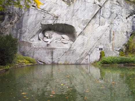 The Dying Lion Monument or the Lion of Lucerne. A historic landmark sculpture in Lucerne, Switzerland that commemorates the Swiss Guards who were massacred in 1792 during the French Revolution.