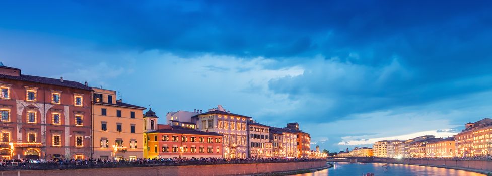 Pisa, Italy. Lungarno Gambacorti and Pacinotti at night during Luminara festival.