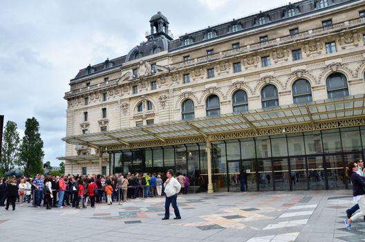 Paris, France - May 14, 2015: Visitors at the Main entrance to the Orsay modern art Museum in Paris, France.The museum houses the largest collection of impressionist and post-impressionist masterpieces in the world