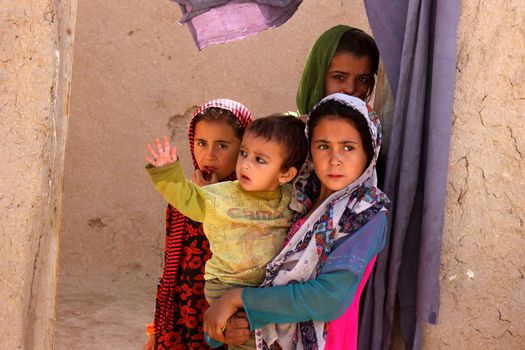 AFGHANISTAN, Kandahar: Tens of thousands of children in Kandahar don't attend school, due to a shortage of teachers and school buildings, the cost of schooling, and the cultural beliefs around education for girls. These photos capture children not in school who play on the streets or care for siblings, as well as some of the lucky ones who are being educated. Pictures taken on September 11, 2015. All children have parental permission to be photographed. 