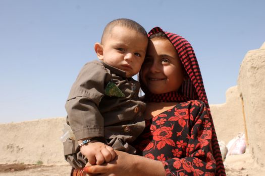 AFGHANISTAN, Kandahar: Tens of thousands of children in Kandahar don't attend school, due to a shortage of teachers and school buildings, the cost of schooling, and the cultural beliefs around education for girls. These photos capture children not in school who play on the streets or care for siblings, as well as some of the lucky ones who are being educated. Pictures taken on September 11, 2015. All children have parental permission to be photographed. 