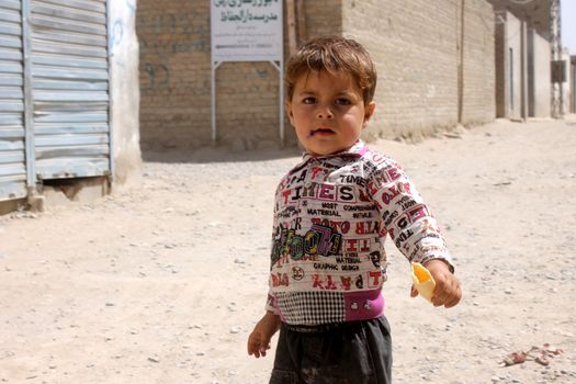 AFGHANISTAN, Kandahar: Tens of thousands of children in Kandahar don't attend school, due to a shortage of teachers and school buildings, the cost of schooling, and the cultural beliefs around education for girls. These photos capture children not in school who play on the streets or care for siblings, as well as some of the lucky ones who are being educated. Pictures taken on September 11, 2015. All children have parental permission to be photographed. 