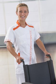 nurse pushing a wheelchair isolated on white background