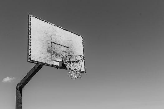 Baskeball hoop on a sunny day.