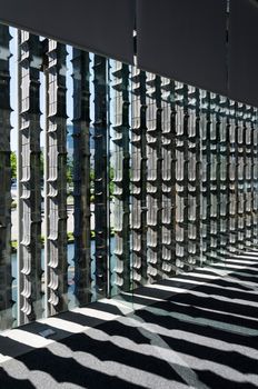 Vertical extruded brick wall with light and shadow, vertical arrangements