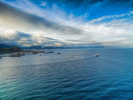 Aerial view of Hurtigruten sailing by the coast of Lofoten islands