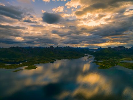Breathtaking view of reflecting clouds on Vesteralen islands with their dramatic mountain peaks
