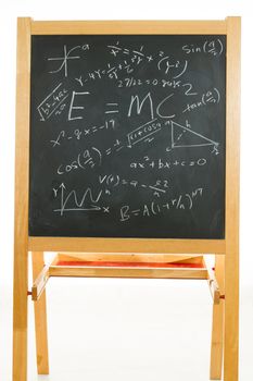 Blackboard or chalkboard with mathematics formulas in plain isolated white background.