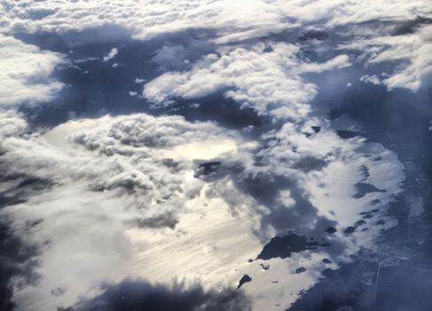 sky with clouds at a height in the air