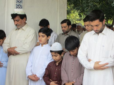 PAKISTAN, Peshawar: Muslims celebrate Eid-al-Adha by offering prayers at a mosque in Peshawar, Pakistan on September 25, 2015. The festival marks the end of Hajj, which is a holy pilgrimage that many Muslims make every year.  	