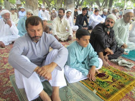 PAKISTAN, Peshawar: Muslims celebrate Eid-al-Adha by offering prayers at a mosque in Peshawar, Pakistan on September 25, 2015. The festival marks the end of Hajj, which is a holy pilgrimage that many Muslims make every year.  	