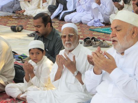 PAKISTAN, Peshawar: Muslims celebrate Eid-al-Adha by offering prayers at a mosque in Peshawar, Pakistan on September 25, 2015. The festival marks the end of Hajj, which is a holy pilgrimage that many Muslims make every year.  	