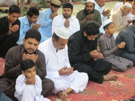 PAKISTAN, Peshawar: Muslims celebrate Eid-al-Adha by offering prayers at a mosque in Peshawar, Pakistan on September 25, 2015. The festival marks the end of Hajj, which is a holy pilgrimage that many Muslims make every year.  	