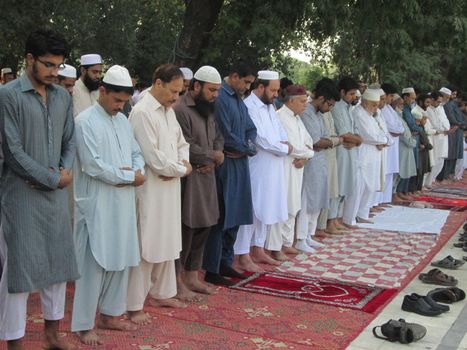 PAKISTAN, Peshawar: Muslims celebrate Eid-al-Adha by offering prayers at a mosque in Peshawar, Pakistan on September 25, 2015. The festival marks the end of Hajj, which is a holy pilgrimage that many Muslims make every year.  	