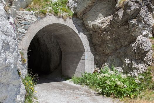 Small dark tunnel in a Swiss mountain