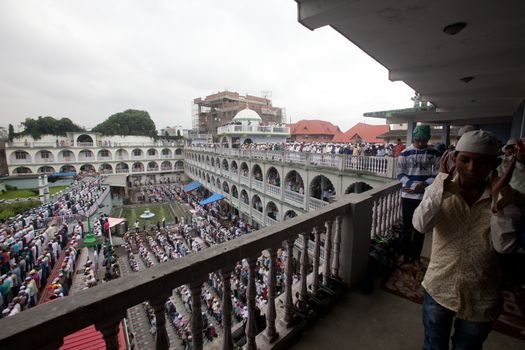 NEPAL, Kathmandu: Muslims worshippers, some standing on balcony and others in a courtyard, celebrate Eid-al-Adha by offering prayers at a Kasmere Jama mosque in Kathmandu, Nepal on September 25, 2015. The festival marks the end of Hajj, which is a holy pilgrimage that many Muslims make every year. People of Islamic faith have felt more comfortable celebrating Eid ul-Adha in Nepal after the country ushered in a new democratic, secularist constitution