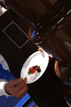 strawberries with melted chocolate on plate