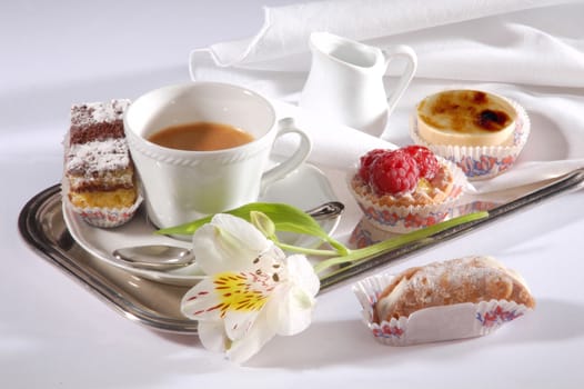 breakfast tray with coffee and pastries