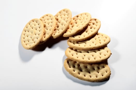 group of crackers in a semicircle on white background