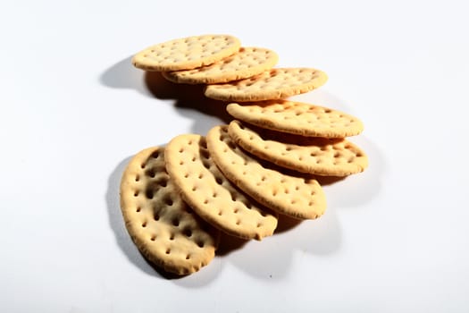 group of crackers in a semicircle on white background