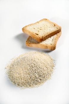 biscuits and bread crumbs on white background