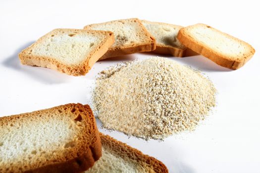 group biscuits and bread crumbs on white