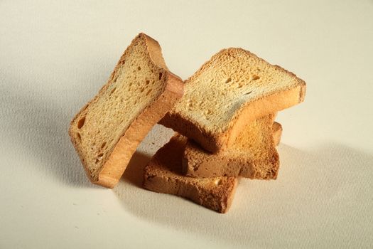 four slices toast viewed from above on a neutral background