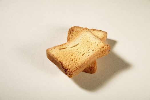 two slices toast viewed from above on a neutral background