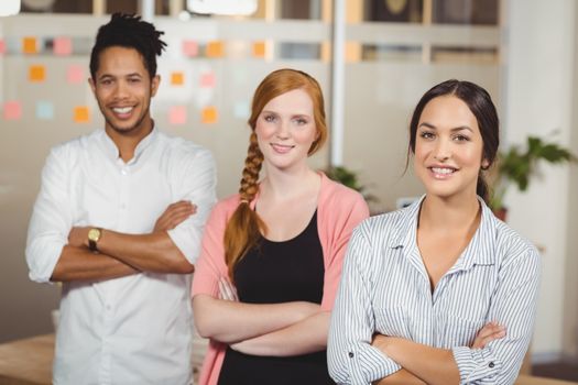 Portrait of confident business people standing at office  