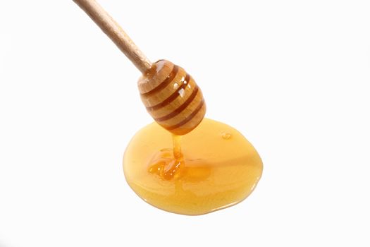 tablespoon honey on white background