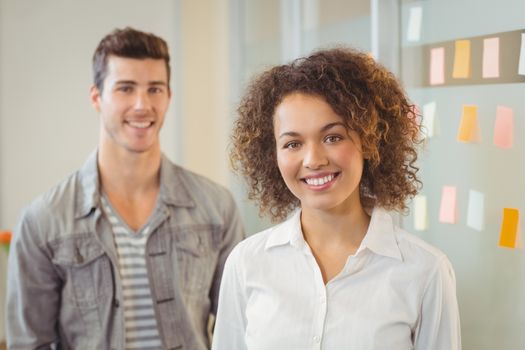 Portrait of smiling confident business people increative office