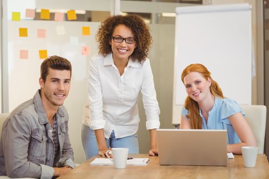 Portrait of confident business people in meeting at office