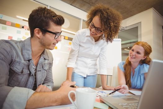 Smiling business people in office during meeting